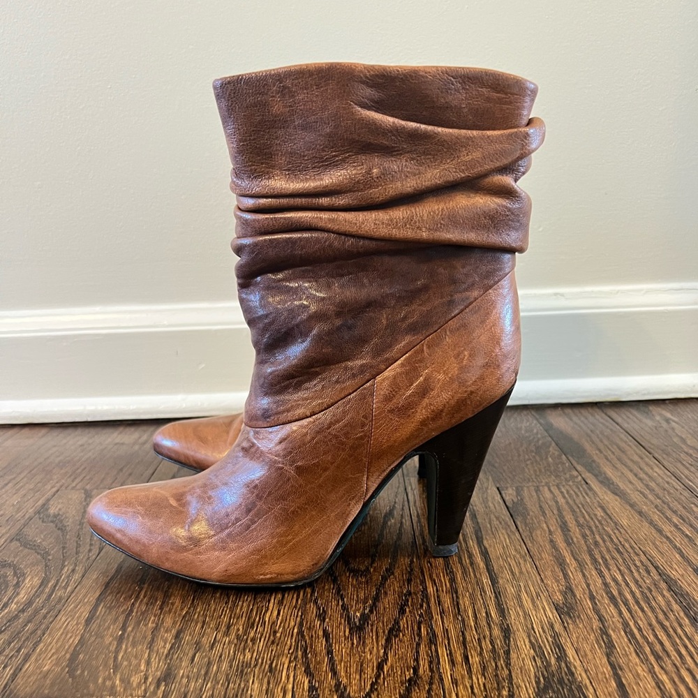 BCBG Max Azria Distressed Pull On Italian Leather Ankle Boots.